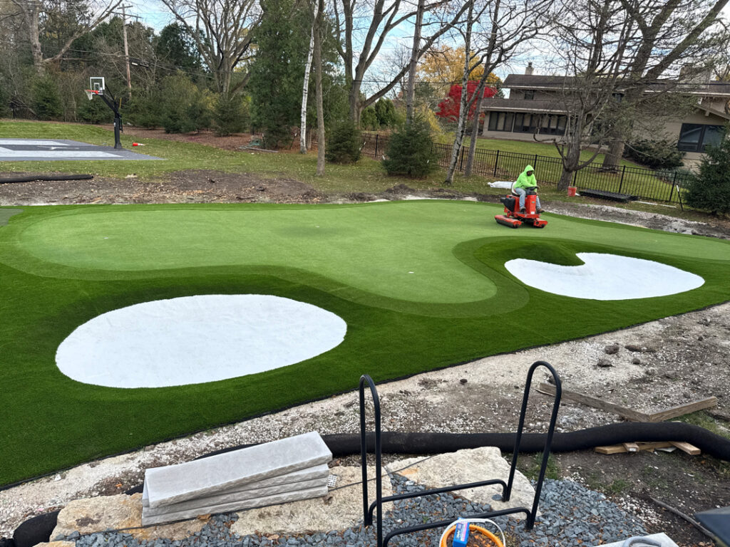 Professionally installed backyard artificial turf and putting green project in Wisconsin.